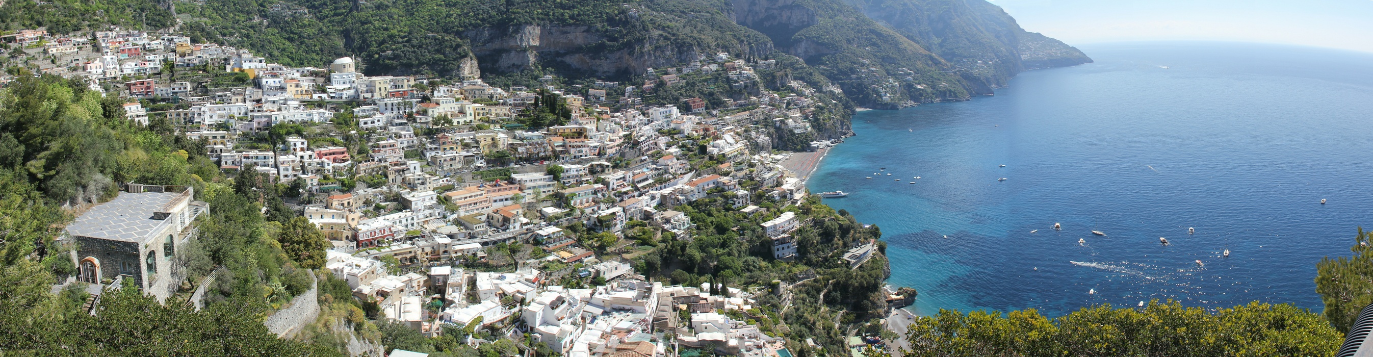 Panoramic nearly 180 deg view of the beautiful town of Positano spilling down the mountainside down to the sea.